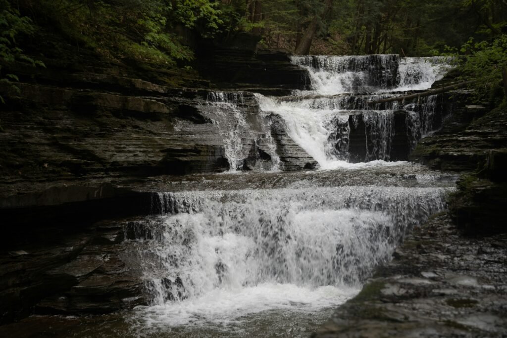 Scenic view of road trip spots in New York, featuring Ithaca, Watkins Glen, and Niagara Falls.
