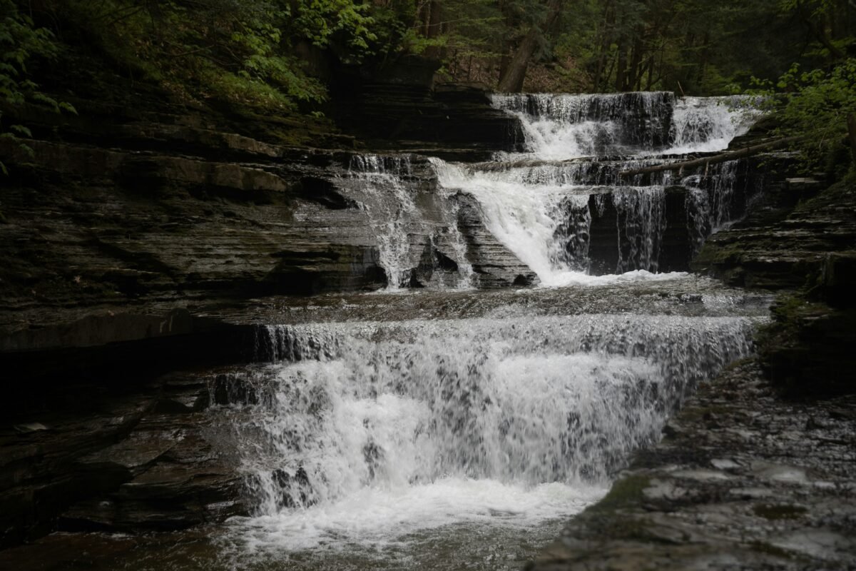 Scenic view of road trip spots in New York, featuring Ithaca, Watkins Glen, and Niagara Falls.